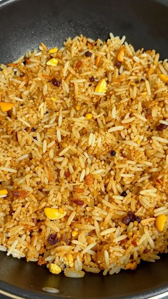 closeup of fried rice with crisp, toasted edges on skillet