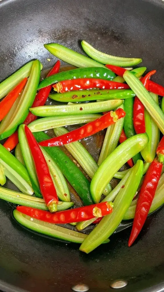 Closeup of crisp-tender mixed veggies sizzling in wok