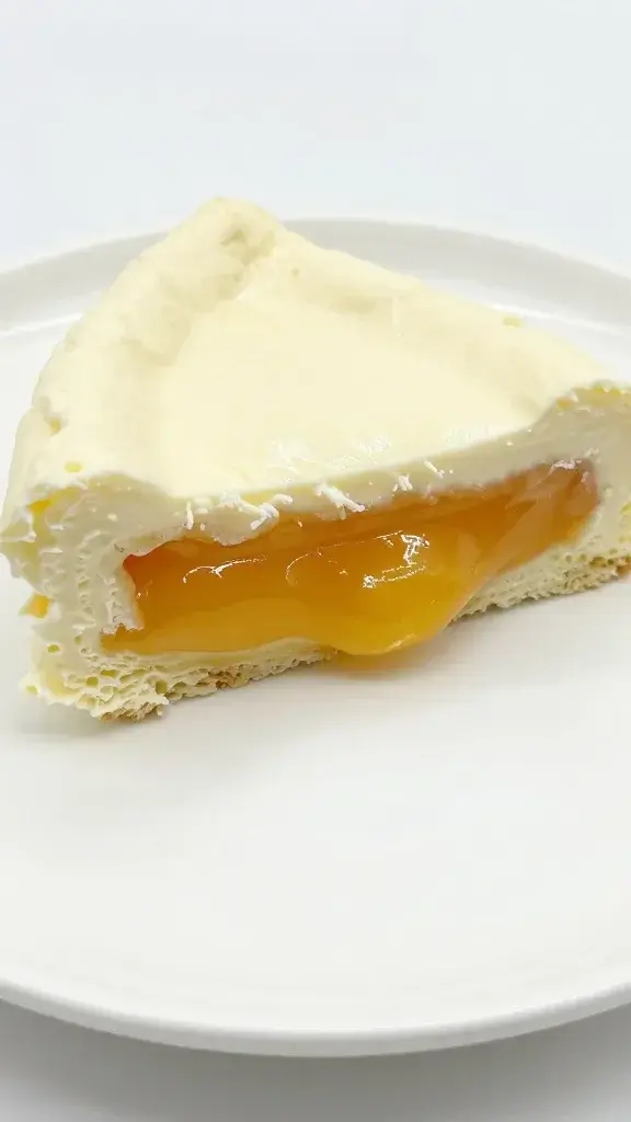 solo slice revealing gooey center, pristine white plate closeup