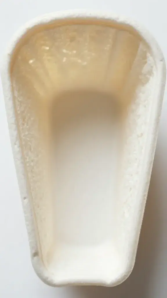 top-down closeup of a single angel food cake cone cavity; airy crumb detail
